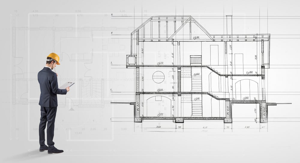 Architect watching a 2 dimension house plan